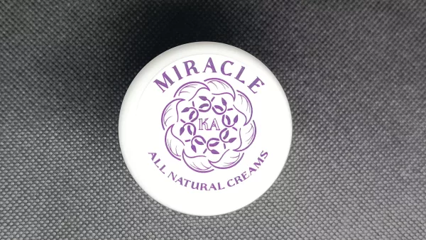 Miracle KA Enriched Day Cream jar with natural ingredients like beeswax, aloe vera, and propolis